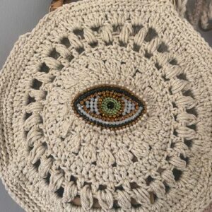 sac rond au crochet fait main oeil protecteur bohème